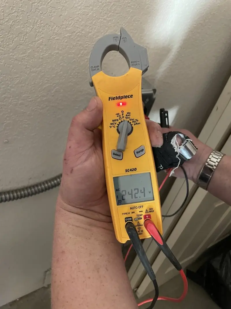 Voltage testing with clamp meter during Ceiling Fan Installation in Archbald